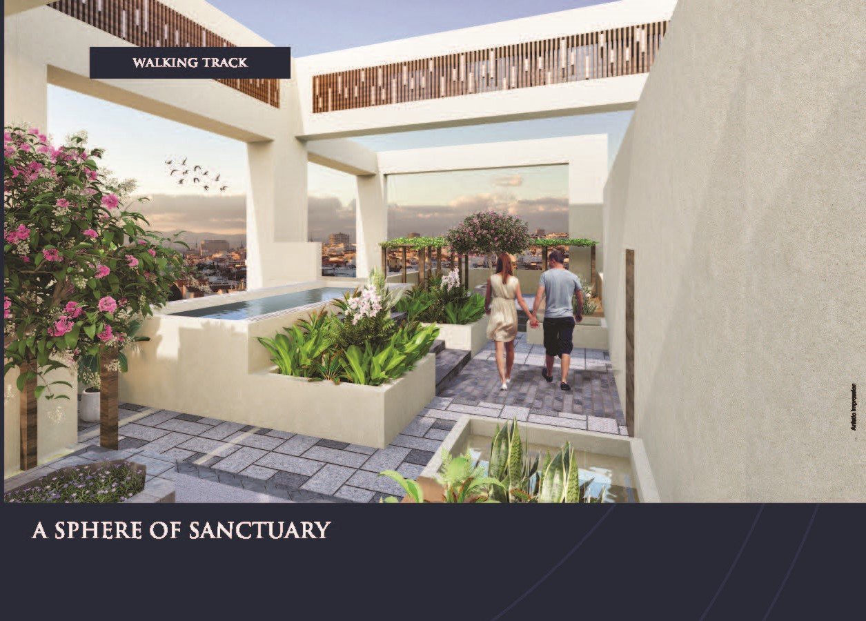 Peaceful landscaped walking path surrounded by greenery at Sunteck Sky Park Mira Road.