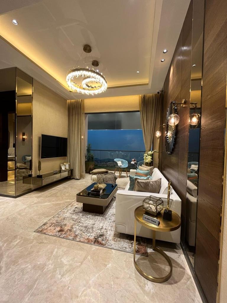 Stylish and spacious living room with premium finishes at Sunteck Sky Park Mira Road.