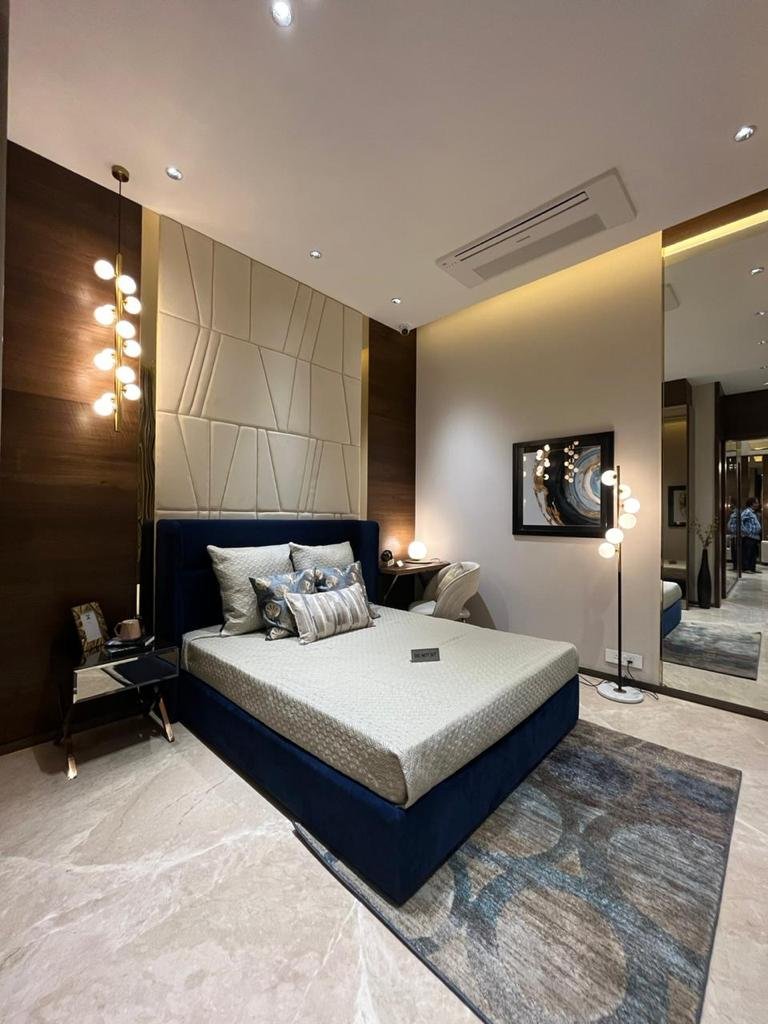 Cozy and well-designed bedroom with elegant interiors at Sunteck Sky Park Mira Road.